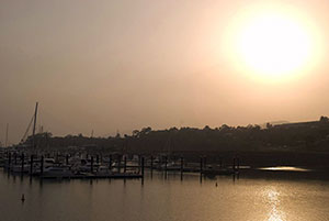 Sun trying to shine through the smog caused by particulate pollution and smoke in the atmosphere giving the air a very poor quality due to toxic photochemicals.  Credit: Stephen D Gibson, photohome.co.uk